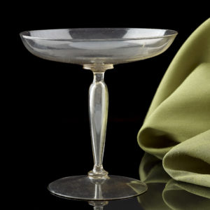 A Venetian wine glass with a low spreading bowl and a ‘ cigar ‘ stem