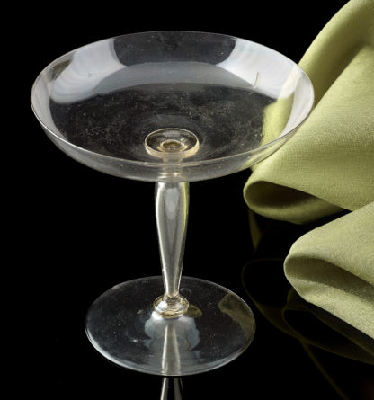 A Venetian wine glass with a low spreading bowl and a ‘ cigar ‘ stem