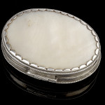 A little carved mother of pearl box with silver mounts, 17th Century Top