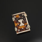 A rare and pretty little Charles II period pin/needle case in the form of a book, c.1660 main