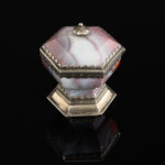 A rare hexagonal Salt made of rose coloured agate, with a hinged lid and silver mounts; German, 17th century main