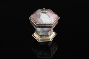 A rare hexagonal Salt made of rose coloured agate, with a hinged lid and silver mounts; German, 17th century main