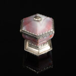 A rare hexagonal Salt made of rose coloured agate, with a hinged lid and silver mounts; German, 17th century side