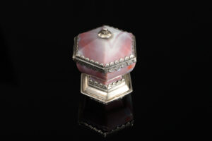 A rare hexagonal Salt made of rose coloured agate, with a hinged lid and silver mounts; German, 17th century side