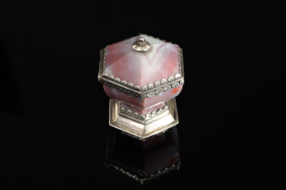 A rare hexagonal Salt made of rose coloured agate, with a hinged lid and silver mounts; German, 17th century side