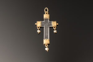 A rock crystal devotional pendant, consisting of a crucifix with gold mounts and small natural pearl drops; Italian, c.1550 main image
