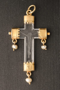 A rock crystal devotional pendant, consisting of a crucifix with gold mounts and small natural pearl drops; Italian, c.1550 close