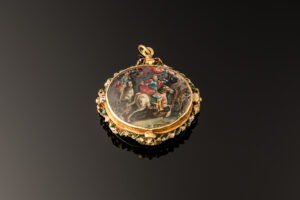A devotional pendant, rock crystal mounted with gold decorated with enamels; Italian or Spanish, mid 17th century horseback side