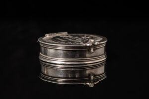 A rare silver travelling Pyx of circular form; English c.1685 back side
