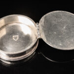 A rare silver travelling Pyx of circular form; English c.1685 back open